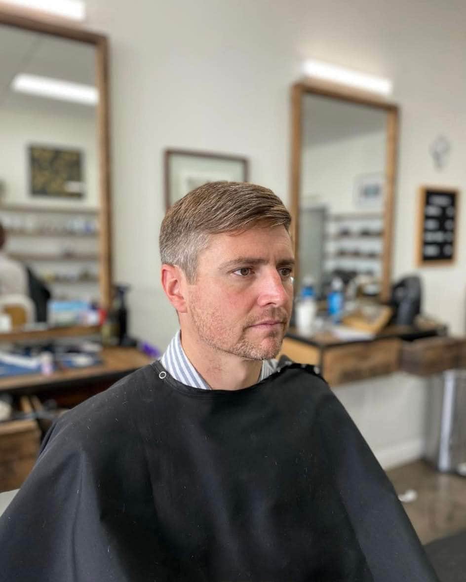 Wolf’s Head Clay Pomade used on classic haircut at Wolf’s Head Barbershop in Santa Barbara – strong hold with dry, low-shine finish