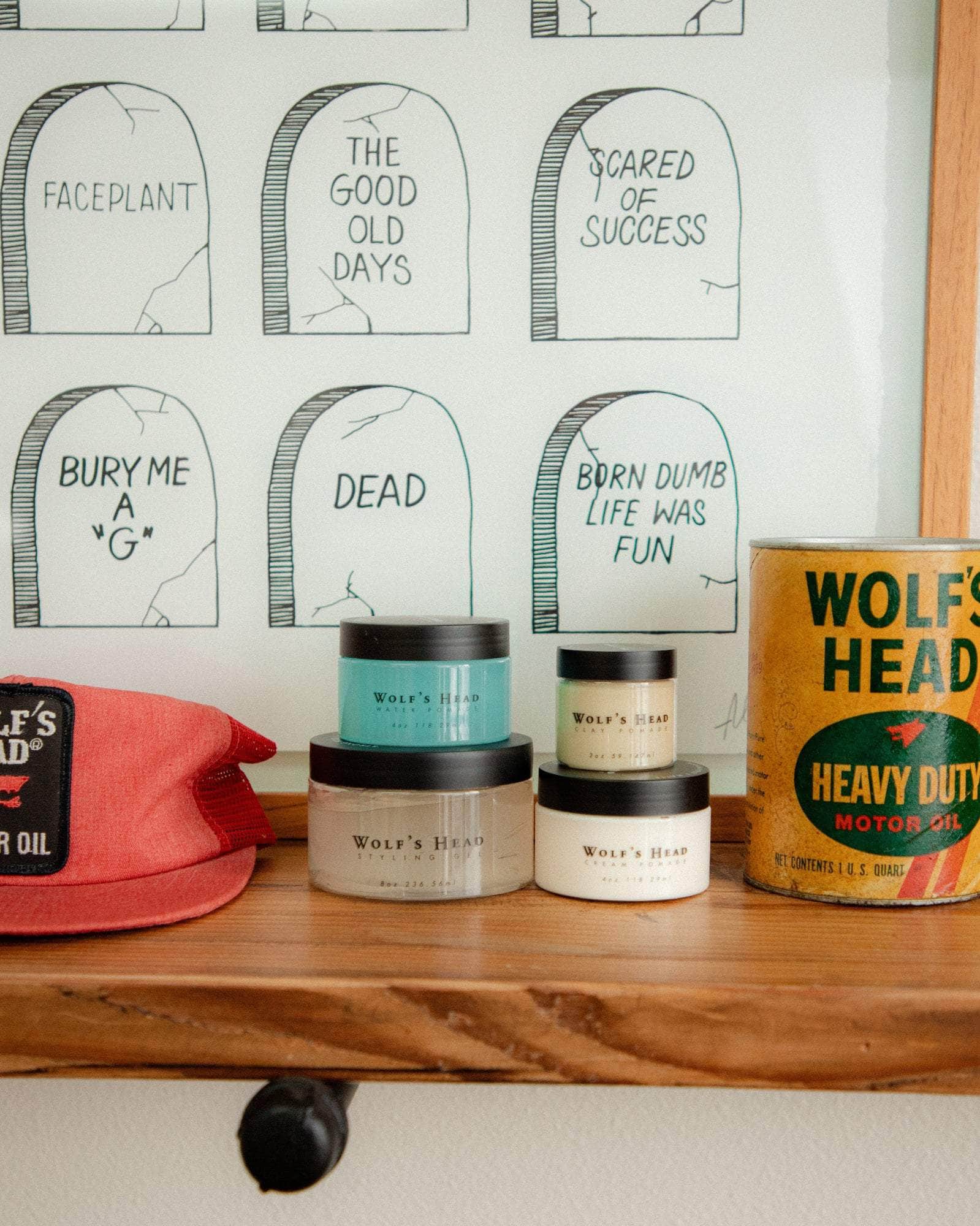 Wolf’s Head Pomades and vintage Motor Oil displayed on retail shelf – strong hold, matte and shine finish hair products made in California