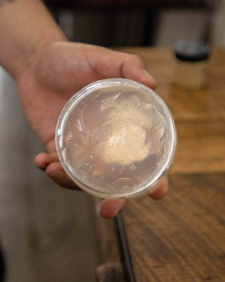 Wolf’s Head How to use Styling Gel Pomade - Jar in hand showing gel detail. Strong hold, high shine, rbershop tested water-based hair product made in California