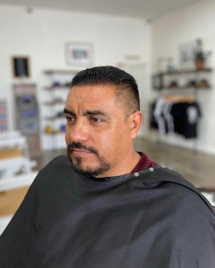 Wolf’s Head Styling Gel Pomade used on short, clean haircut at Wolf’s Head Barbershop in Santa Barbara – strong hold high shine water based hair product made in California