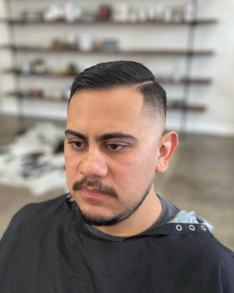 Wolf’s Head Styling Gel Pomade used on side part hairstyle at Wolf’s Head Barbershop in Santa Barbara – strong hold high shine water based hair product made in U.S.A.