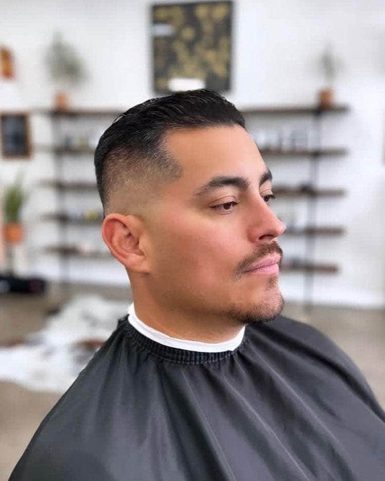 Wolf’s Head Styling Gel Pomade used on modern hairstyle at Wolf’s Head Barbershop in Santa Barbara – strong hold high shine water based hair product -California Made