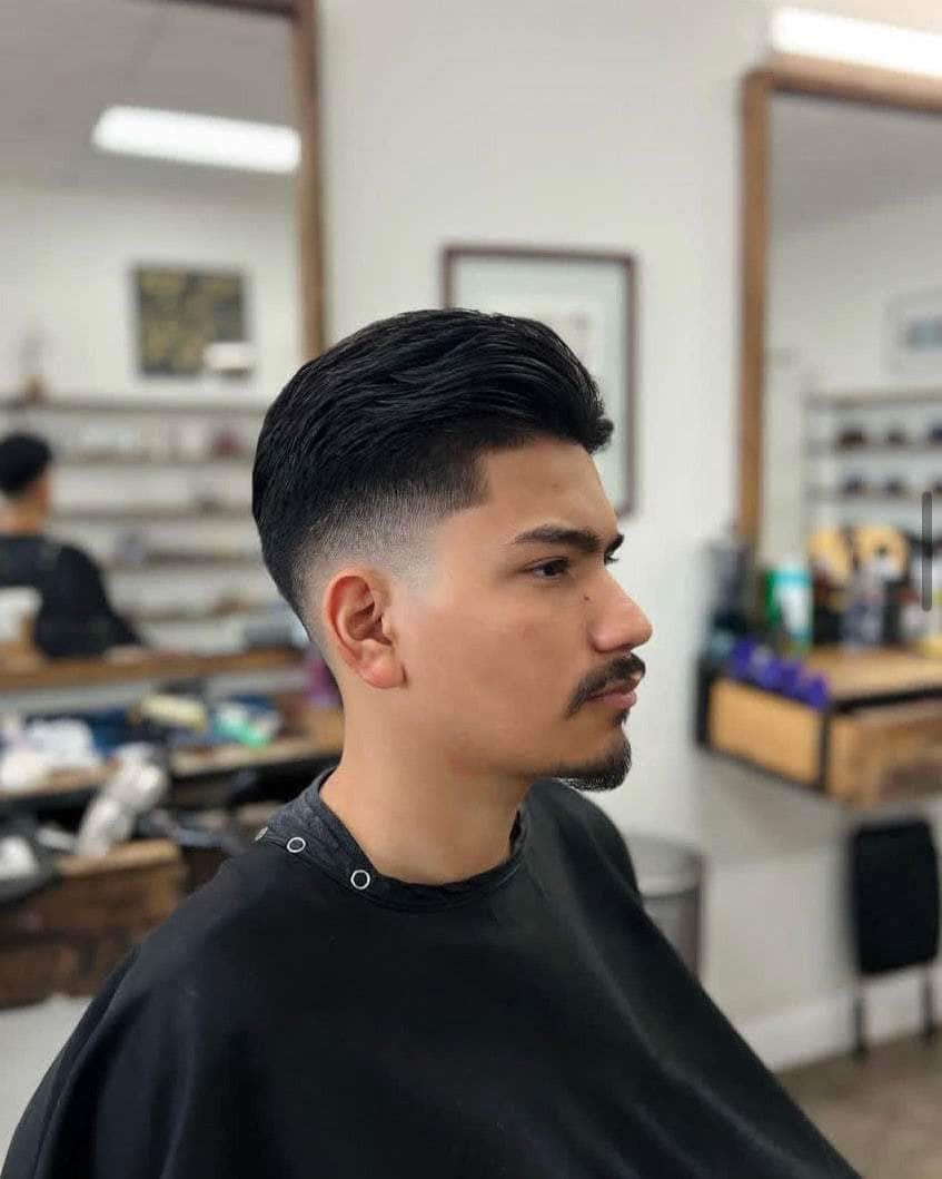 Wolf’s Head Water Soluble Pomade used on classic haircut at at Wolf's Head Barbershop in Santa Barbara – strong hold, shine finish water based hair product