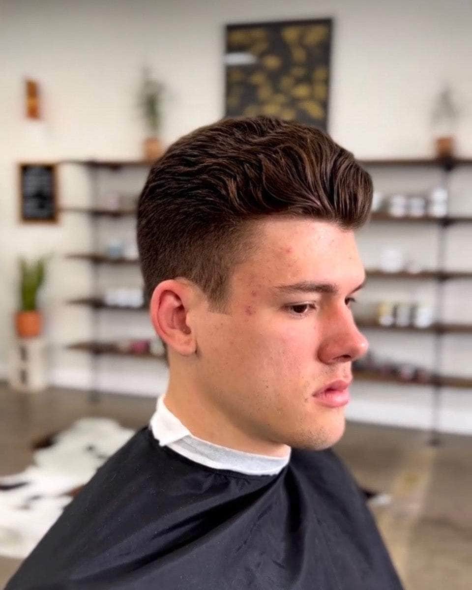 Wolf’s Head Cream Pomade used on mid length hairstyle at a barbershop – medium hold, natural matte finish hair product