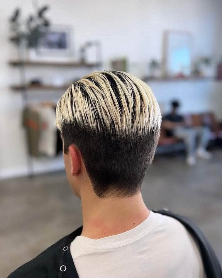 Back view of Wolf’s Head Cream Pomade in use on a modern light hold hairstyle at Wolf's Head Barbershop in Santa Barbara – Medium Hold Matte Finish Hair Product. Made in California