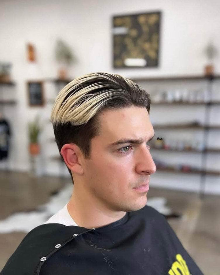 Wolf’s Head Cream Pomade in use on a modern light hold hairstyle at Wolf's Head Barbershop in Santa Barbara – Medium Hold Matte Finish Hair Product. Made in California