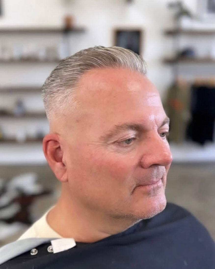 Wolf’s Head Clay Pomade used on thinning hair at Wolf’s Head Barbershop in Santa Barbara – strong hold with matte finish. Adds texture and fullness.