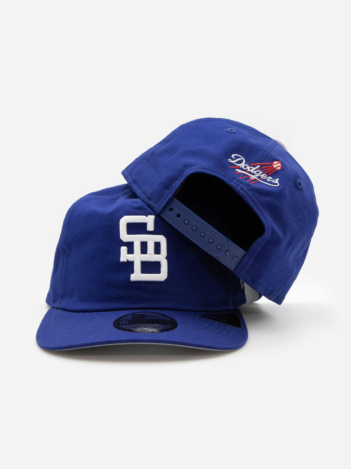 Santa Barbara Dodgers New Era 19TWENTY Royal Blue Golfer Hat Stacked - Quality Headwear with SB dodgers embroidery. Available at Wolf's Head. Ships free in the US for order $35+