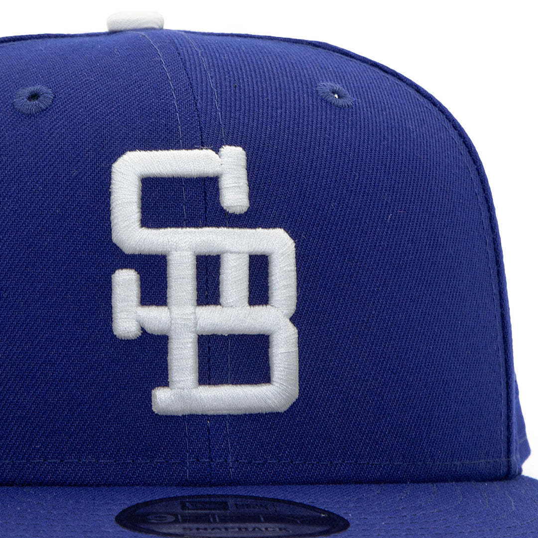 Santa Barbara Dodgers x New Era Dodger Blue 9FIFTY Snapback Hat – Quality Headwear & Classic Streetwear Baseball Cap. Available at Wolf's Head. Detail Front