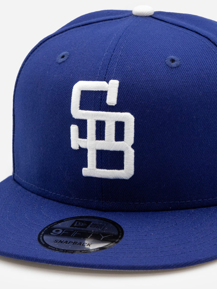 Santa Barbara Dodgers New Era 9FIFTY Royal Blue Snapback Hat Front Detail - Quality Headwear with SB dodgers embroidery. Available at Wolf's Head. Ships free in the US for order $35+