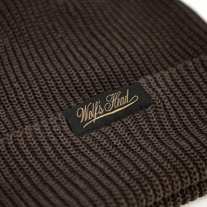 Wolf’s Head Script Label Shaker Knit Beanie – Brown Label Detail Close-Up