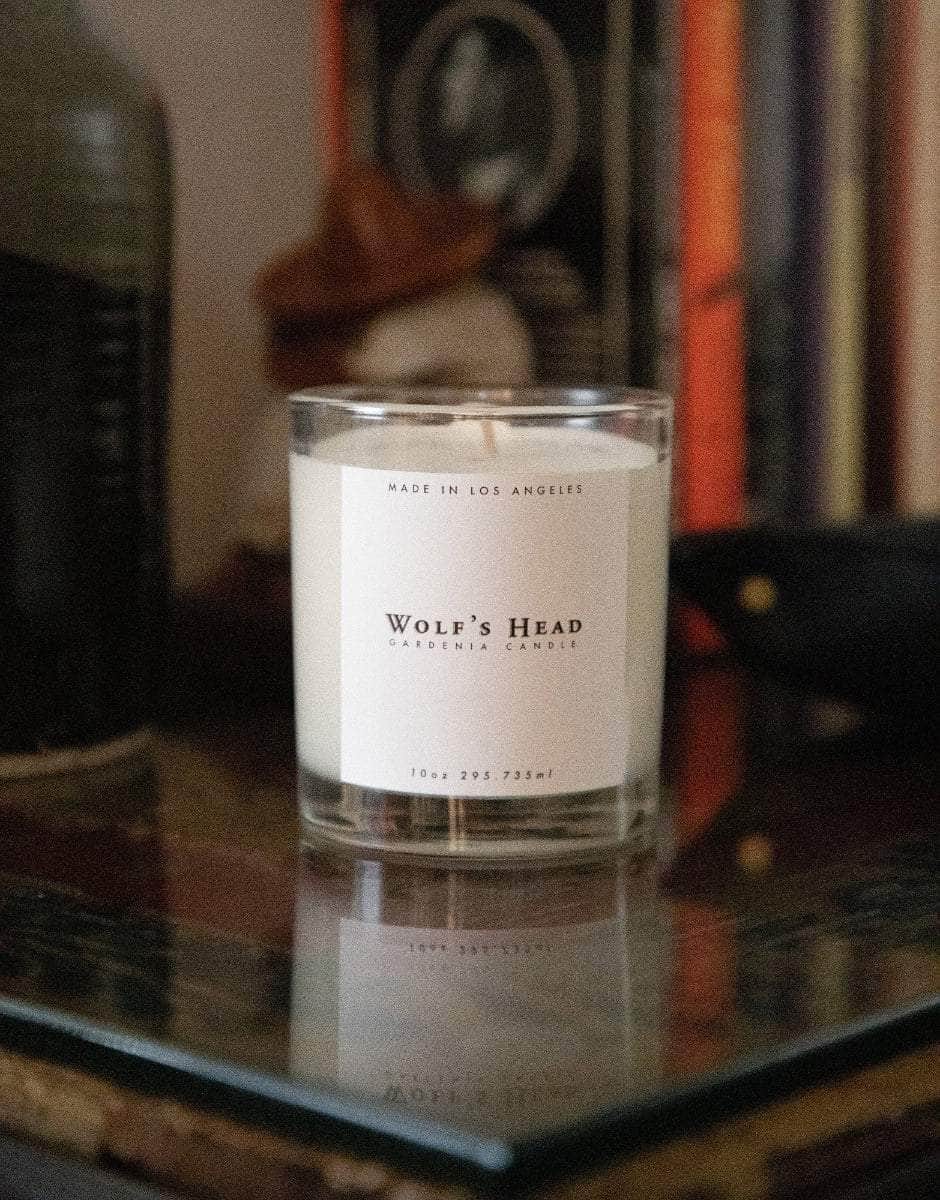 Wolf’s Head Gardenia Candle on a glass table with lived in home feel - small-batch, soy-based candle with a clean burn and subtle floral scent. A California-made essential for refined, everyday atmosphere.